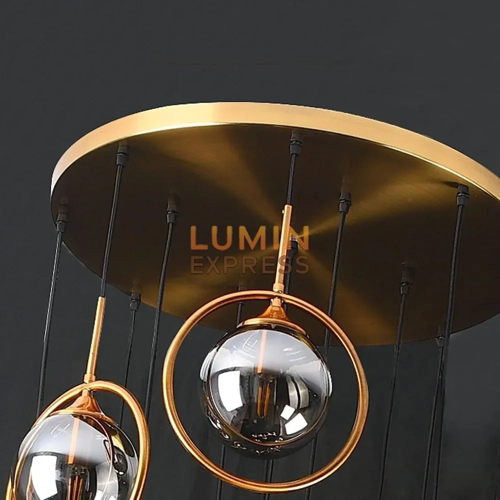 Luminaire contemporain doré avec boules lumineuses