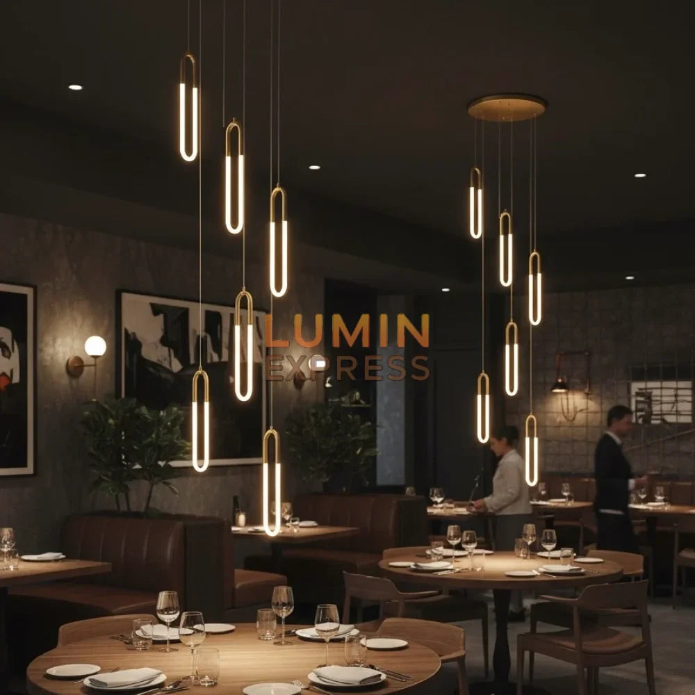 Lustre WARNER doré – éclairage architectural pour restaurant 